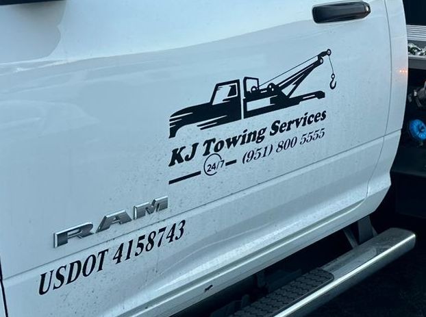 KJ Towing Services door decal with phone number and USDOT 4158743